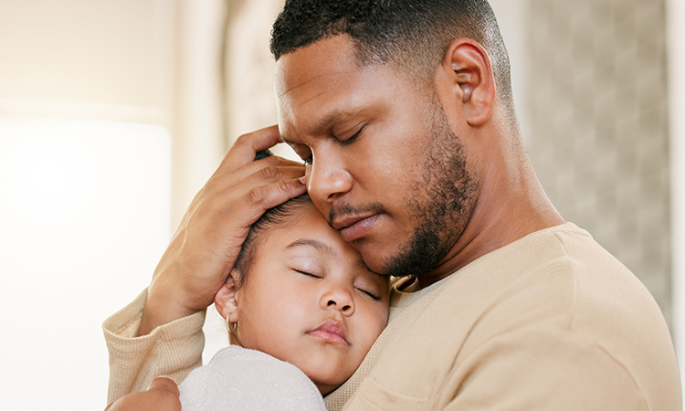 Father hugging daughter